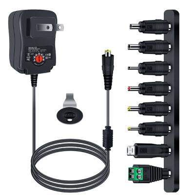 China Universal 12W Universal Adapter AC/DC Switching Power Supply with 8 Selectable Tips, for 3V to 12V Household Electronics for sale