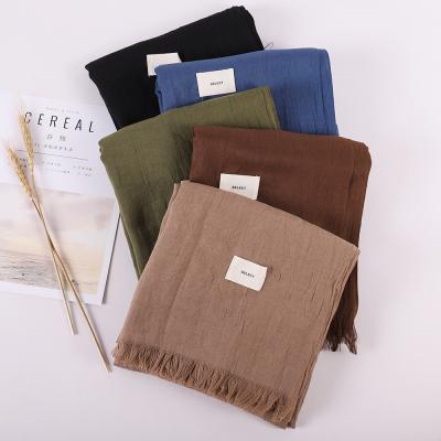 China Brand New Scarf Women Hijab Fashion Design Solid Color Cotton And Canvas Scarf With Tassels for sale