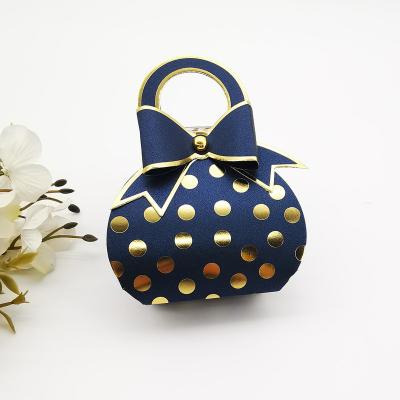 China Newly Design Recyclable Handbag Shape Small Dots Foil Stamping Luxury Wedding Party Candy Paper Packaging Gift Box for sale