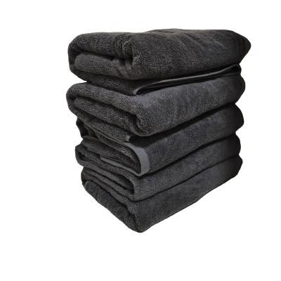 China Luxury Plushy dobby border premium bath towels 100% cotton for sale