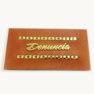 China Customized Viable Embossed Faux Leather Label With Metal For Jeans for sale