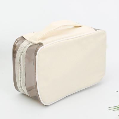 China Transparent Portable Cosmetic Custom Logo PVC Canvas Double Zipper Cosmetic Bag Fashion Storage Bag for sale