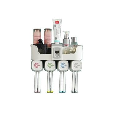 China Sustainable Toothpaste Dispenser Wall Mount For Bathroom A Family Of Four Automatic Toothpaste Dispenser Toothbrush Holder for sale