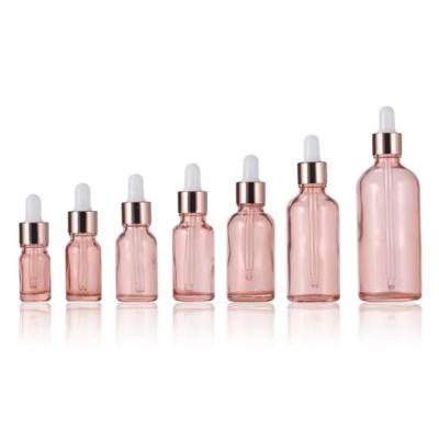 China Großhandel rosa Glas Essential Flasche mit goldenen Aluminium Tropfkappe zu verkaufen