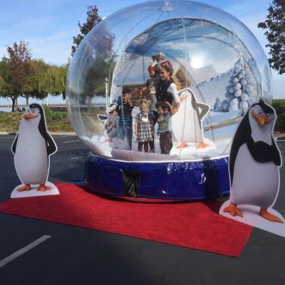 China 0.8mm PVC Size Outdoor Inflatable Human Snow Globe Photo Booth With Blowing Snow for sale