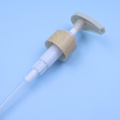 China Impresión de transferencia de agua sin derrames de plástico de madera bomba de tornillo Dispensador cosmético Dispensador de loción de champú Dispensador en venta