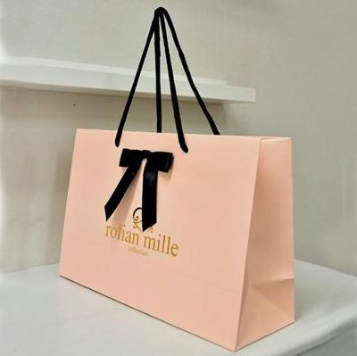 China FUHING Bow Ribbon Paper Bags Recyclable Luxury Pink Black Pink Gift Tote Bag Clothing Shopping Paper Bag With Cotton Handle for sale