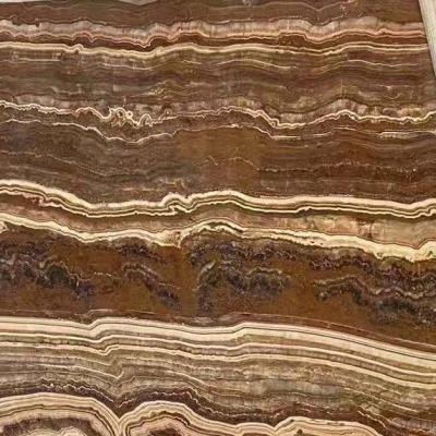 China Natural Kashmir Onyx Brown Onyx Stone Mateiral Home Decor Coffee Line For Design Slabs Tiles Wall Floor for sale