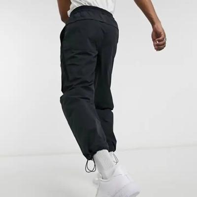 China Custom Casual Sports Anti-Wrinkle Fitness Pants Running Jogging Cargo Jogger Pants Nylon Jogger For Men for sale