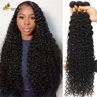 China Cabello natural negro rizado de pelo humano brasileño Envases de extensiones de cabello en venta