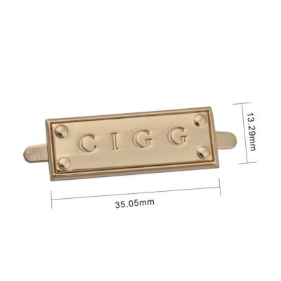 China Eco-friendly custom metal plates brand logos for handbag , debossed metal letter logo label for sale