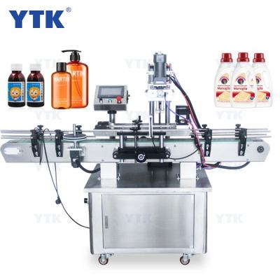 China High Speed Automatic Food YTK Screw Capping Machine With Auto Cap Feeder for sale