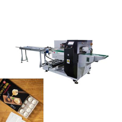 China Máquina de embalagem de almofadas de alimentos congelados rápidos 550kg 25-100 embalagens/min Produção à venda