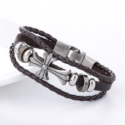 China Popular punk style sells European and American men's punk alloy retro braided cross leather bracelet for men for sale