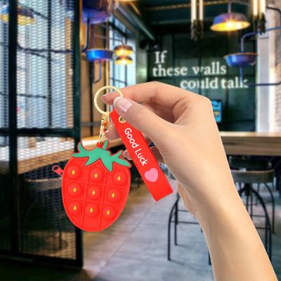 China 2021 Fashion Strawberry Mini Bubble Sensory Portable Wallet Earphone Case Wiggle Key Chain Toys Coin Purse for sale
