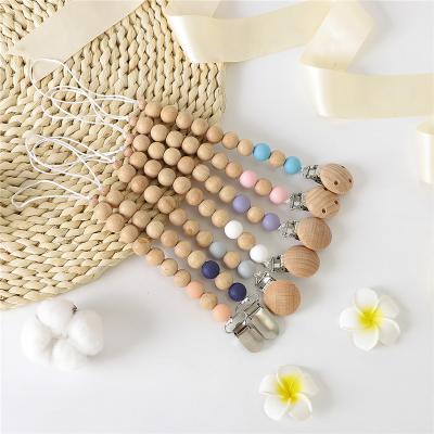 China Soft Toy Food Grade Organic Wooden Pearl Clip Baby Pacifier Clip for sale