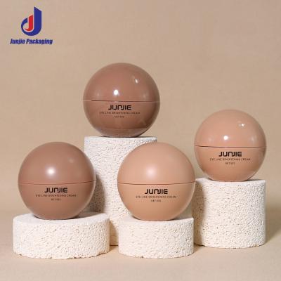 China Recipiente para esfoliante corporal de 10g, 15g, 20g, 25g, 30g e 50g, em formato de bola, frascos para cuidados com a pele, cosméticos, creme, pote de plástico com logotipo à venda