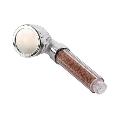 China Without Needle Filter Mineral Stone Water Saving Negative Ion Transparent Spa Hand Held Shower Head for sale
