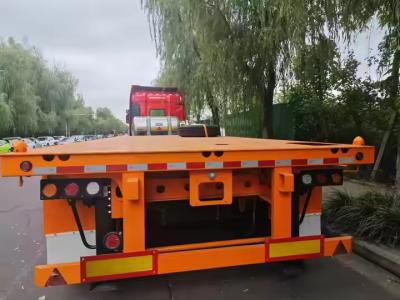 China Eje doble longitud de la textura de hierro de 10 a 20 metros de trabajo pesado de baja plataforma de transporte camión semirremolque en venta