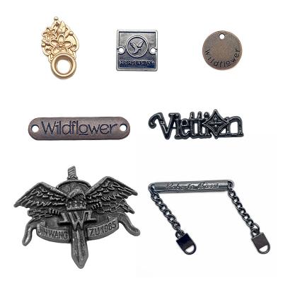 China Sustainable Custom Hollow Design Making Apparel Metal Label Sewing Garment Tags Logo for sale