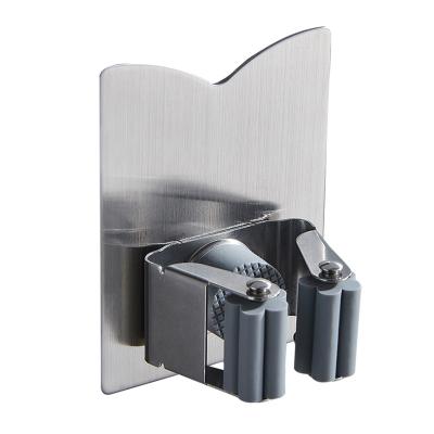 China 2021 Selling Kitchen Bathroom Kitchen Broom Mop Tool Holder Viable Household Hot Adhesive Storage Rack Gray Broom Hanger 304 Stainless Steel Mop Holder for sale