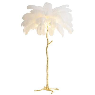 China Modern hotel-residence decoration designer palm stand copper ostrich floor lamp with feathers for sale