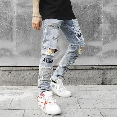 China 2021 spring and autumn viable pants slim fit national jeans youth hip hop hole printed gaiters men for sale