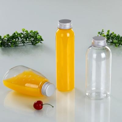 China New custom logo disposable clear PET milk tea bottle plastic juice bottle food packaging with aluminum lid for sale