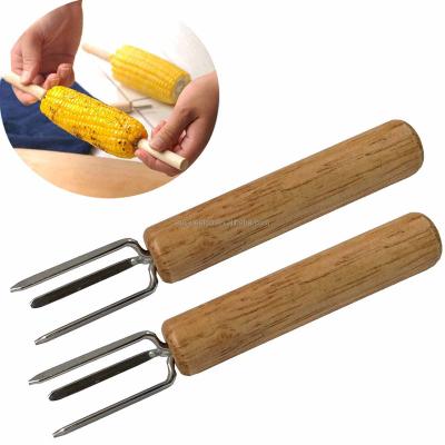 China Easily Cleaned Wooden Handle Stainless Steel Meat Fruit Branches Barbecue Corn Cob Holder Corn Strip for sale