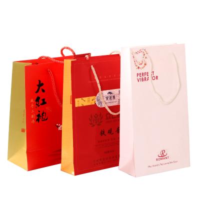 China Beautiful Biodegradable Exquisite Customized Logo Printing Tote Bag Customized Shopping Paper Bag With Handles Or Ropes for sale