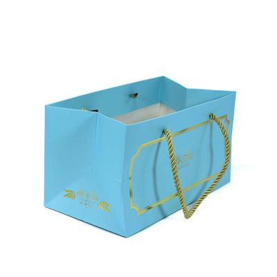 China Wholesale Price Biodegradable Custom Gold Foil Stamping Blue Reusable Packaging Gift Tea Bag Shopping Paper Bag With Ribbon Handles for sale