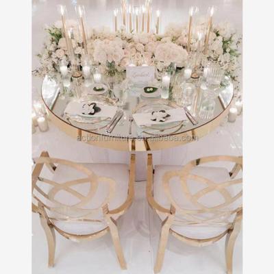China Laser Cutting Gold Round Stainless Steel Cake Table With Mirror Glass Top for sale