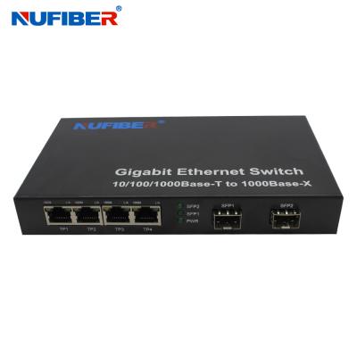 中国 10/100/1000Mの4港Rj45+2 SFPの港の繊維光学のイーサネット スイッチ媒体のコンバーター 販売のため