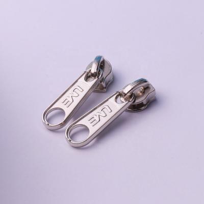 China Bag Slider 4# Metal Zipper Slider Nickel Free Pull With Hole Engraved Logo for sale