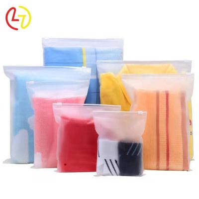 China Custom Frosted Moisture Proof PE Zipper Slider Garment Packaging Bag With Logo Packaging Garment Plastic Bag for sale