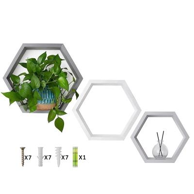 China Tipo de montaje en la pared Estantes flotantes hexagonales de madera personalizados para decoración de la habitación de los niños en venta