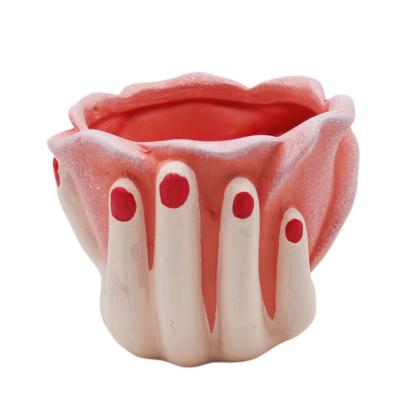 China Modern creative home decoration corrosion resistance style human hand mounted flower pots and creative ceramic planters pots for sale