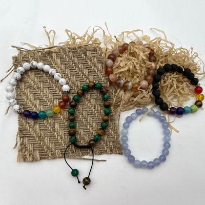 China New Arrival Eco-friendly 8mm Natural Lava Stone Rock Braided Rope Yoga 7 Chakra Round Bead Custom Adjustable Bracelet For Women Men for sale