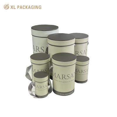 China Embalaje en cilindro gris personalizado Caja redonda Tubo de papel de flores para regalo cosmético de flores en venta