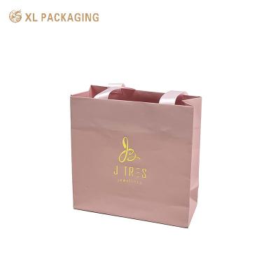 China Color rosa personalizado Bolsas de embalaje de papel regalo Bolsa de envío de regalo Logotipo impreso en venta
