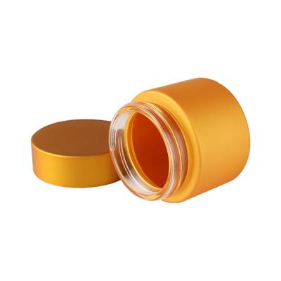 China Wide Mouth 2oz Gold Glass Weed Jar Screw Cap For for sale