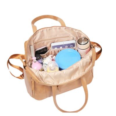 China Mom's Large Capacity PU Leather Diaper Tote Bag Backpack Set With Changing Mat And Stroller Strap For Travel Organizer for sale
