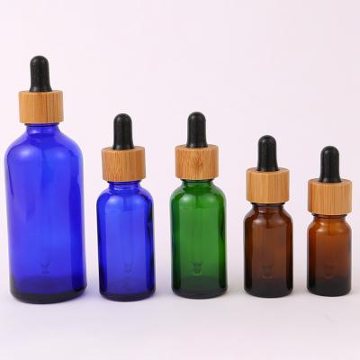 China Essential Oil Frosted Bamboo Dropper Glass Bottle in 1oz 2oz 5ml 15ml 30ml with Easy and Cosmetic Serum Box for sale