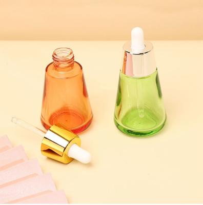 China Industrial Cosmetic Elegant 30ml 50ml 1oz 2oz Green Empty Oil Serum Dropper Bottles with Box Customize Unique Cone Shape for sale