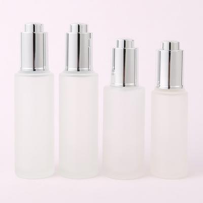 China 30ml Custom Clear Glass Bottle With Pressure Dropper for Cosmetic Skincare Packaging Frosted Color Collar and Free Sample for sale