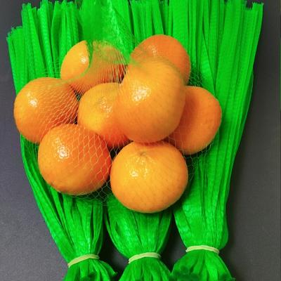 China Hot Selling Orange Vegetable Package Eco-friendly Mesh Fruit Net Knitted Plastic Mesh Bag Roll Garlic Tomato for sale