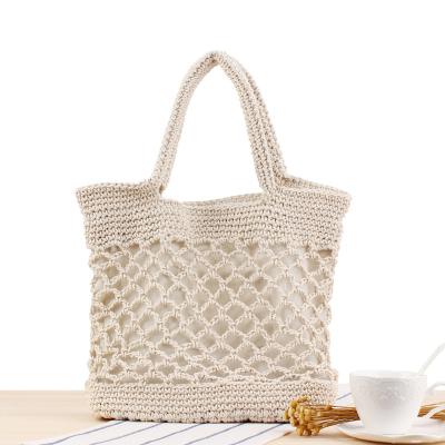China New Solid Color SP766 Cotton Yarn Durable Hand Crocheted Bag Female Forest Vacation Beach Portable Straw Bag for sale