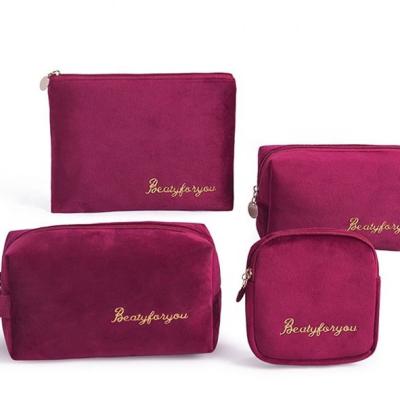 China Lady Red Beauty Cosmetic wholesale custom made pocket fashion logo embroidery velvet makeup bag gold set for sale