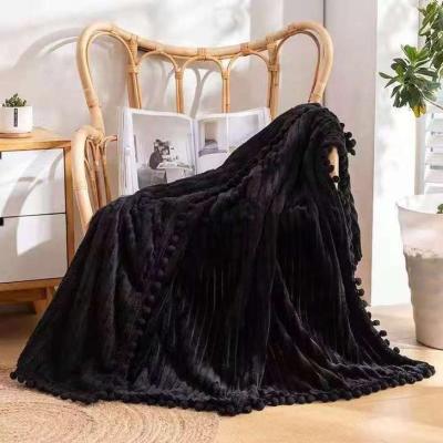 China Wholesale Soft Comfortable Warm Coral Cute Solid Flannel Folded Covering Blanket Fleece With Pom Pom 50x60 Inches for sale