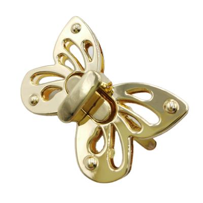 China Nickel Free Customize Butterfly Purse Turn Lock Stable Filter Bezels Twist Lock Light Gold Screwed Down for sale